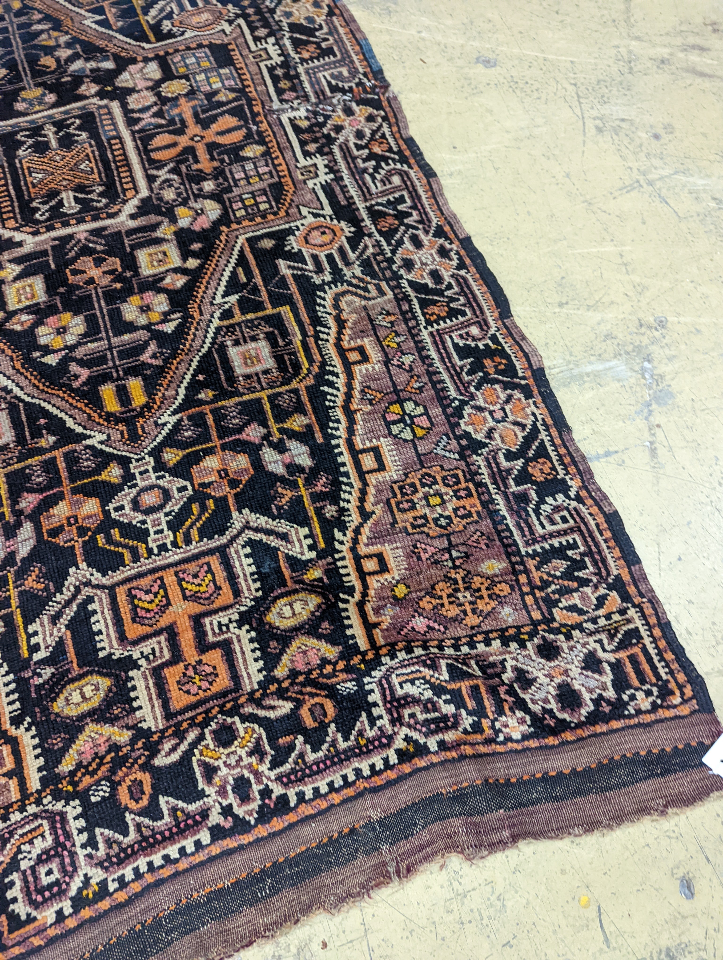 A Caucasian design blue ground rug, 224 x 111cm